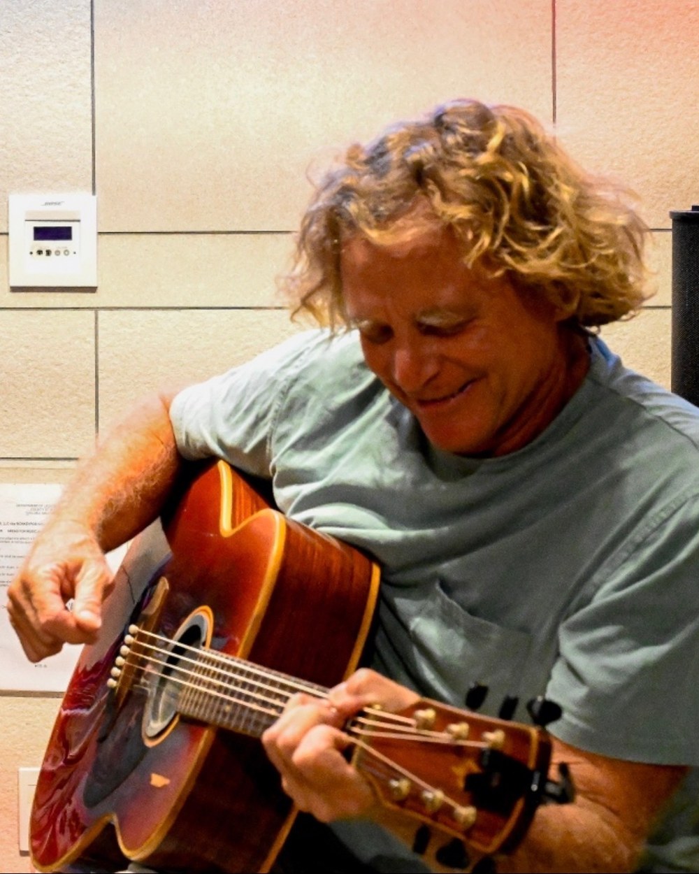Shawn McLaughlin playing acoustic guitar.